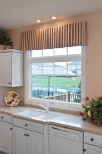 A double-hung window installed over a kitchen sink