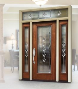 Elegant front door with decorative glass and sidelites.